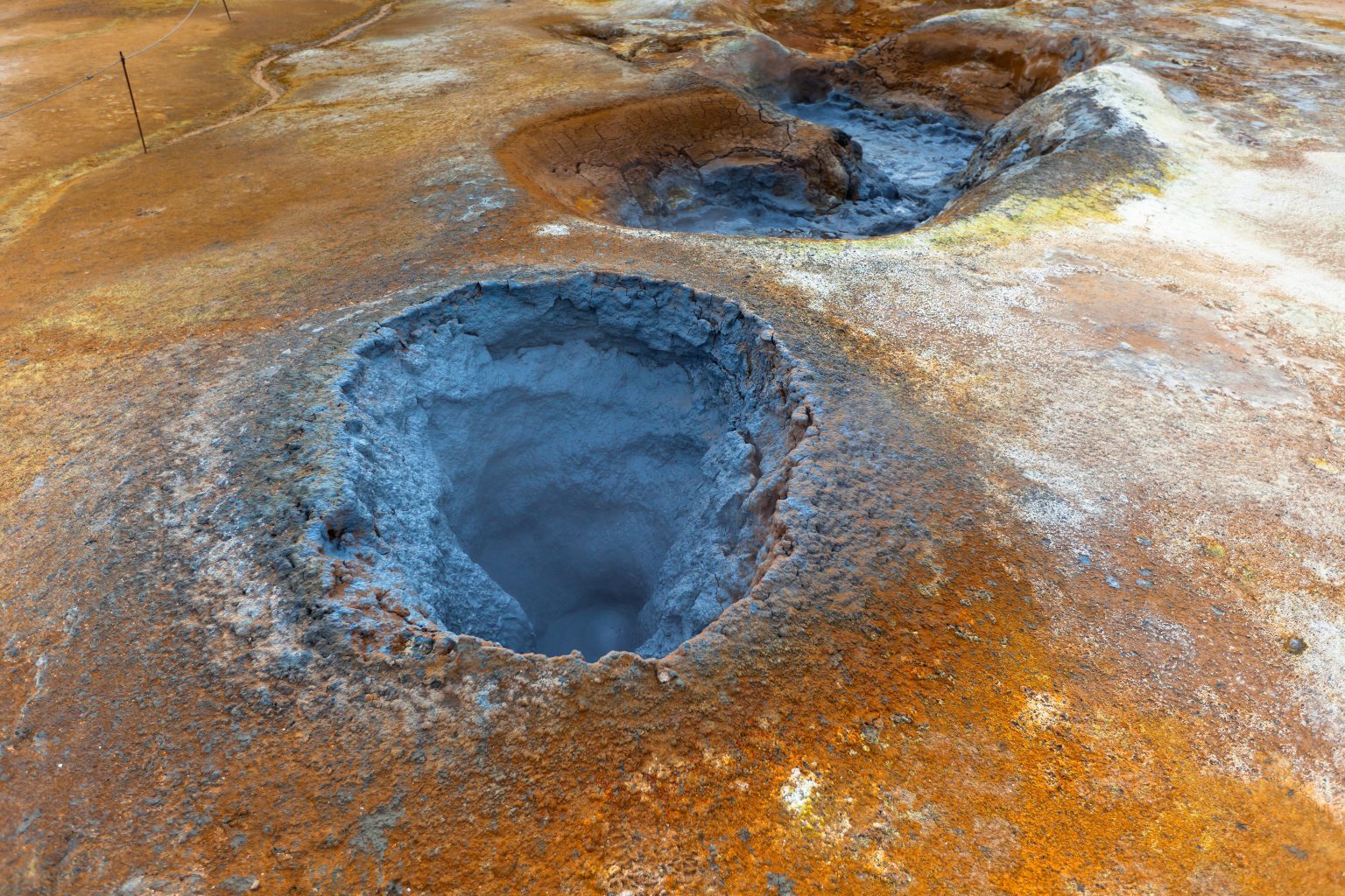 Steaming mud pools and mineral-coloured ground at Hverir, Iceland